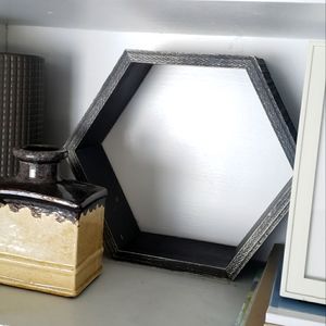 Distressed dark gray wood hexagon wall accent